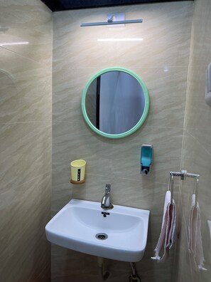 Deluxe Room | Bathroom | Shower, towels, soap, toilet paper - Iira Stays Ocean Bliss (Alibag)