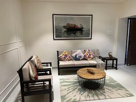 Executive Apartment, Balcony, Partial Lake View | Living area | TV