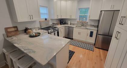 Pristine creekside home in peaceful Maryville with sprawling yard and deck.