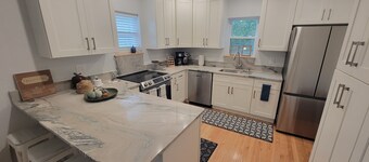 Pristine creekside home in peaceful Maryville with sprawling yard and deck.