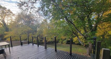 Pristine creekside home in peaceful Maryville with sprawling yard and deck.