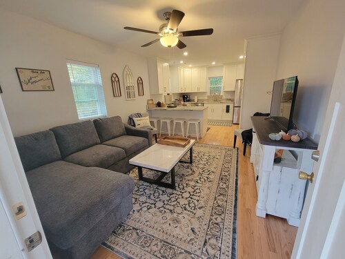 Pristine creekside home in peaceful Maryville with sprawling yard and deck.