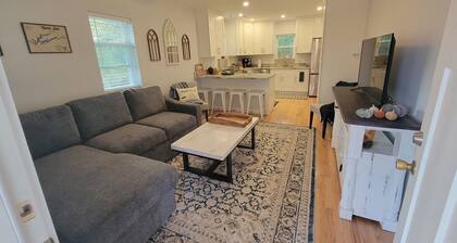 Pristine creekside home in peaceful Maryville with sprawling yard and deck.