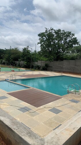 Stay with a swimming pool, gym and free walking space within the property