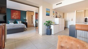 A modern bedroom with a bed, a TV, and a large window. - Apartment in Cannes with 1 bedrooms sleeps 4 (Cannes)