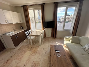 Comfort Apartment, 1 Bedroom, Kitchen, Ground Floor | Private kitchen | Mini-fridge, stovetop, high chair, cookware/dishes/utensils - Dagtekin Apartments (Antalya)