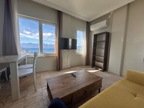 Comfort Apartment, 1 Bedroom, Kitchen, Sea View | Living area | 80-cm TV with satellite channels - Dagtekin Apartments (Antalya)