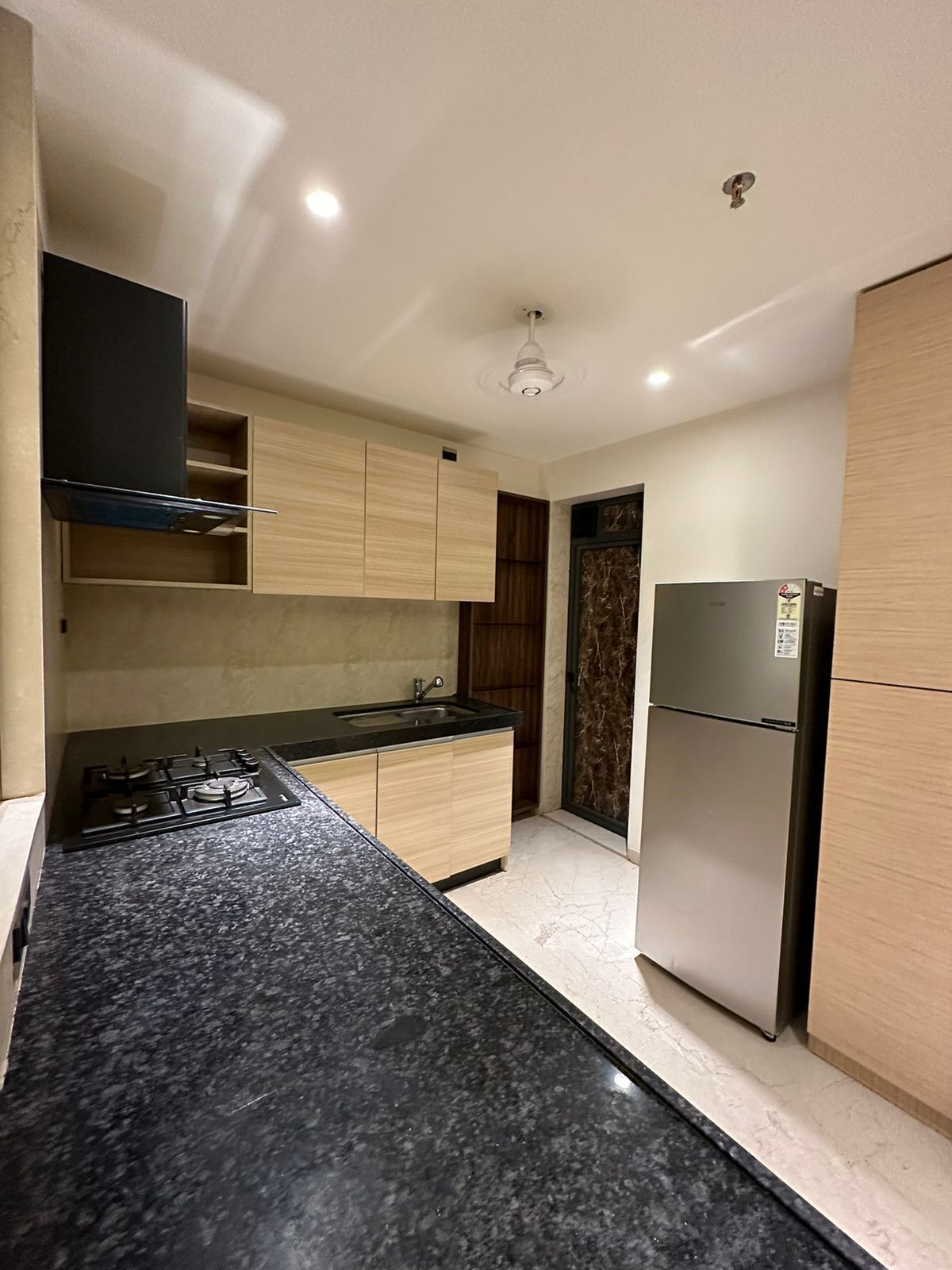 Fridge, stovetop, cookware/dishes/utensils, dining tables