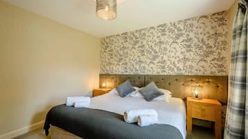 Blackout curtains, iron/ironing board, free cots/infant beds, travel cot