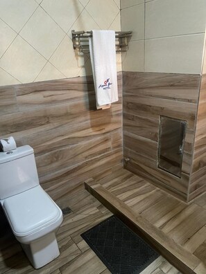 Executive Suite | Bathroom | Shower, towels, toilet paper - Nippon Grand Hotel and Apartment (Abuja)