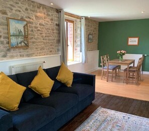 Apartment, Garden View | Living area | 40-inch flat-screen TV with satellite channels - Les Rouges Terres Gîtes  (Saint-Amand)