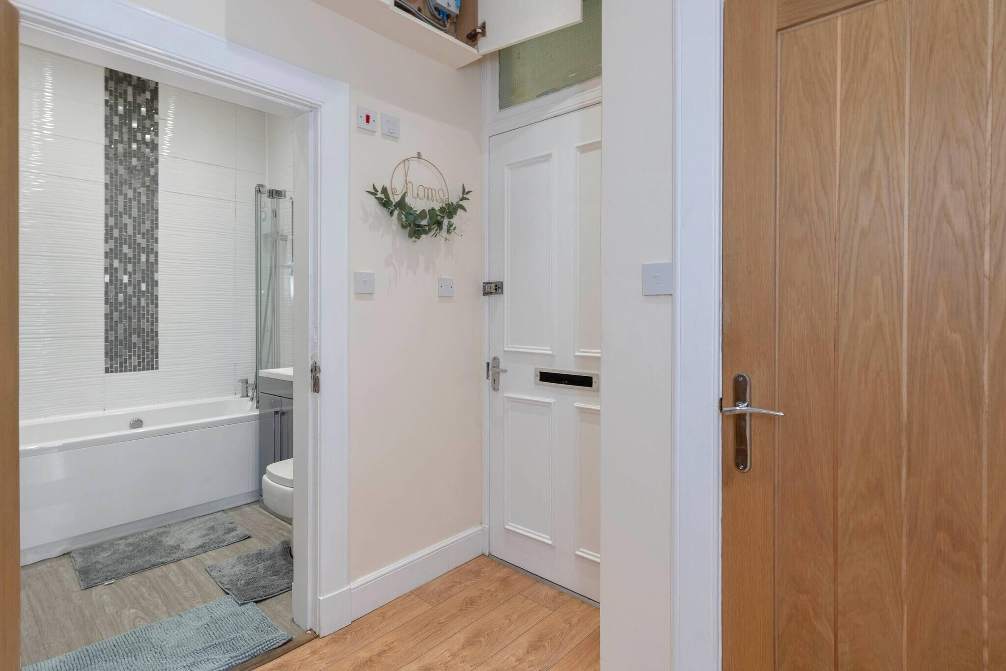 A bathroom with a bathtub, toilet, and shower.