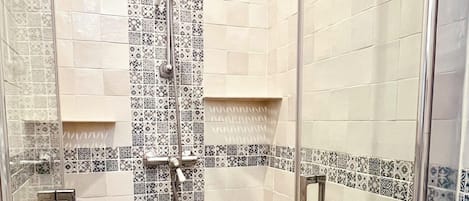 Shower, hair dryer, towels, toilet paper