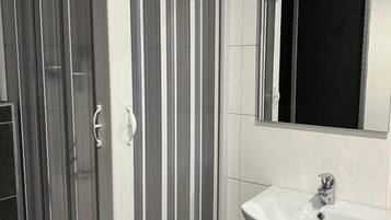 Economy Single Room, City View | Bathroom | Shower, hair dryer, towels, soap