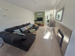 TV, fireplace - Terras Novas Village Paradise offers Sea Views and located in Patroves Albufeira (Albufeira)