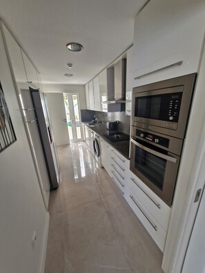 Microwave, oven, stovetop, dishwasher - Terras Novas Village Paradise offers Sea Views and located in Patroves Albufeira (Albufeira)