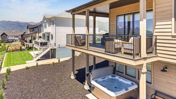 A multi-story house with a balcony, a hot tub, and a view of mountains. - Summit View Lodge, 5br5ba, Sleeps 16, HotTub-Views (Heber City)