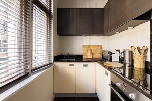 Fridge, oven, stovetop, dishwasher - A calm, design-led Soho apartment with quiet bedrooms, air-con and smart TVs throughout. (London)