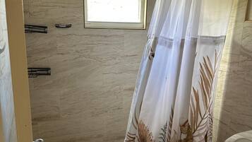 Shower, towels, soap, toilet paper