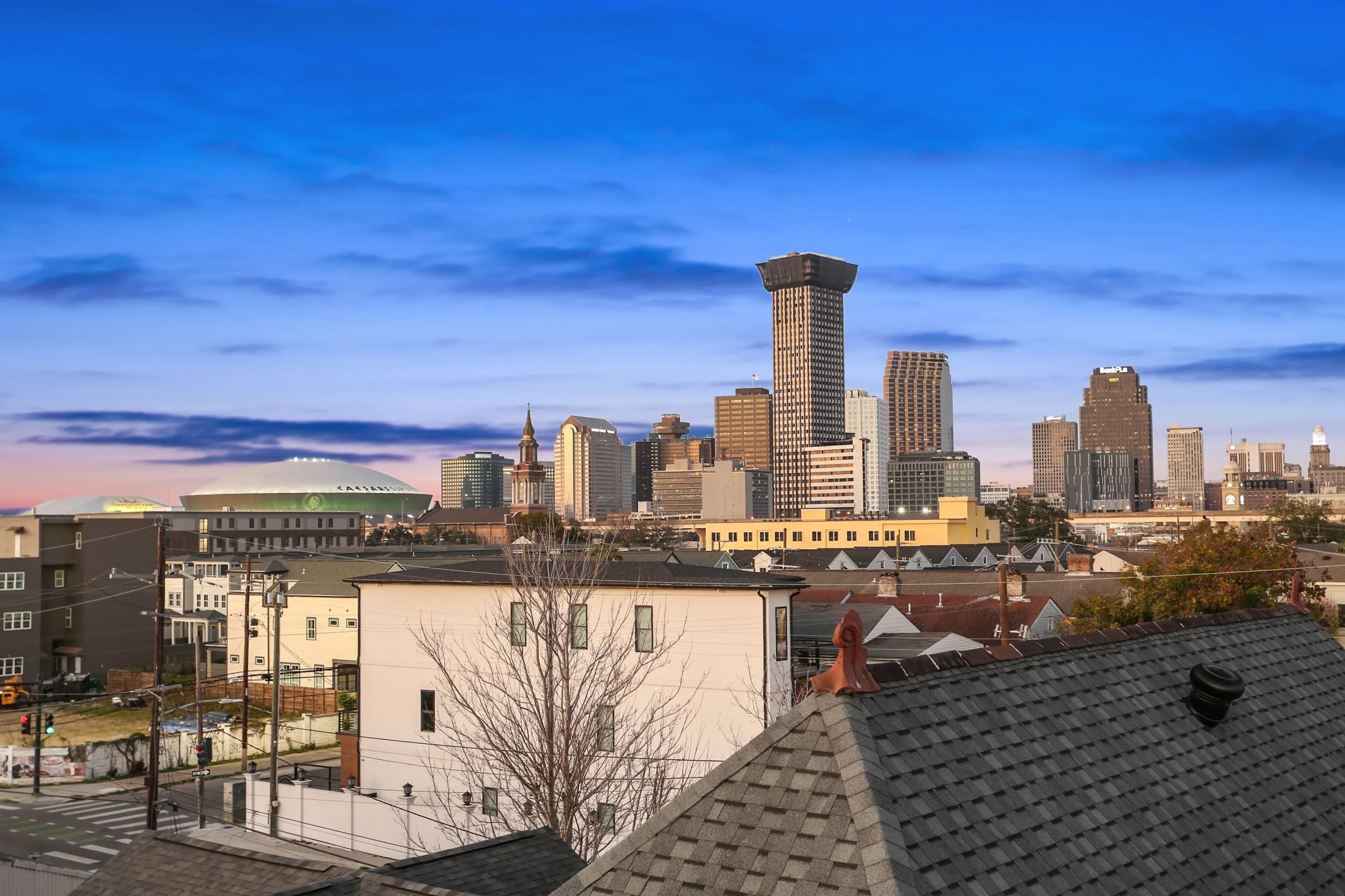 A city skyline with a prominent tower and various buildings.