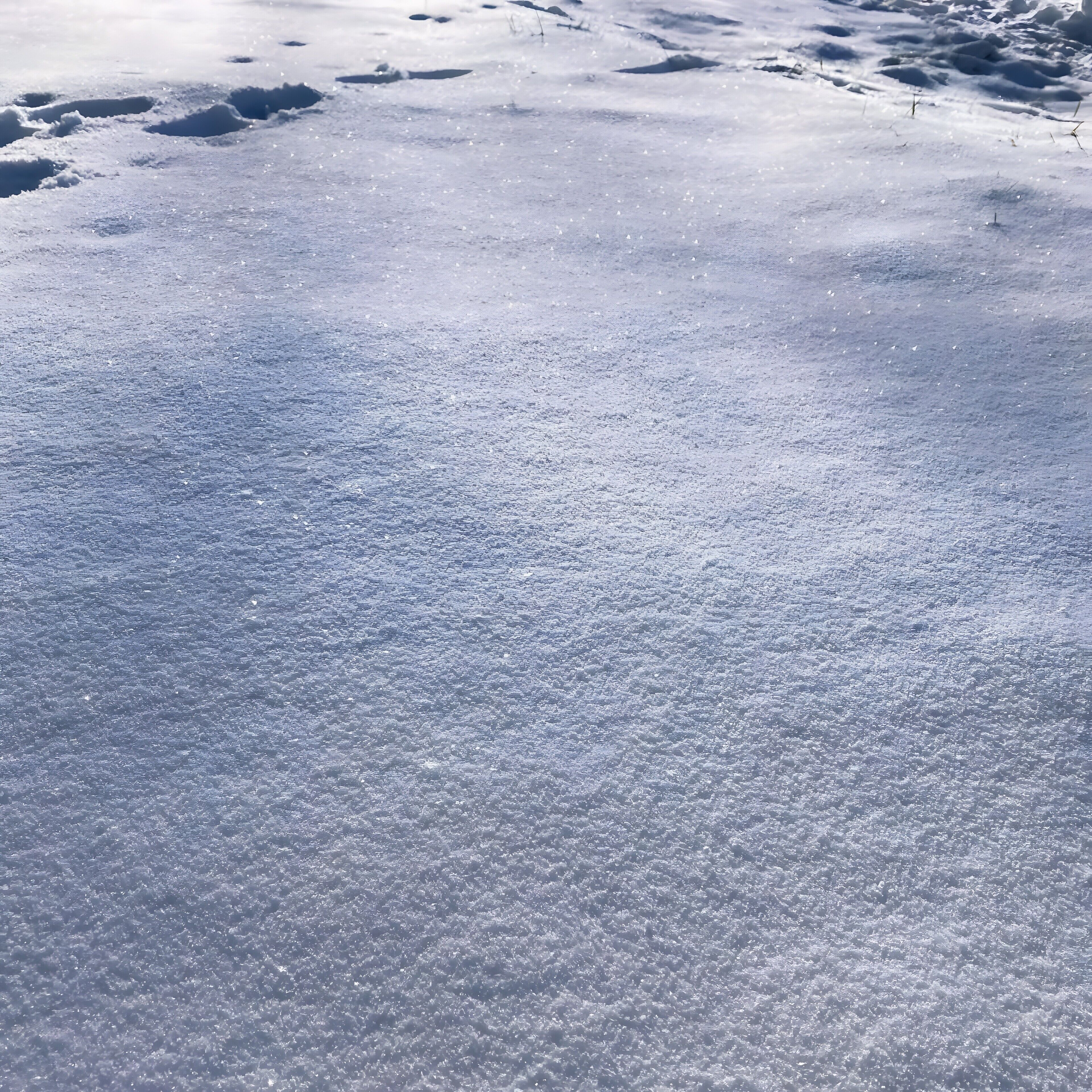 A snow-covered ground with no visible structures or people.