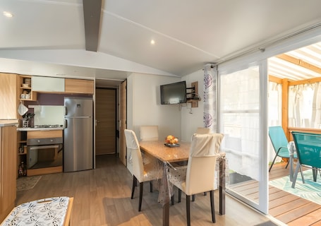Dining. Mobile Home 'Mh324 La Tremblade' with Shared Pool, Private Terrace, and Air Conditioning