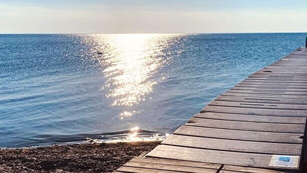 A wooden pier extending into calm waters with a clear sky above. - 4 Person Holiday Home in Morbylanga (Morbylanga)