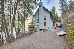 Exterior - Book your next Bayview getaway at this 2-bedroom, 3-bath lakefront retreat on Lake Pend Oreille! Designed for relaxation and adventure, this home features cozy living spaces, a spacious deck with a hot tub, and stunning water and mountain views. (Bayview)
