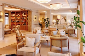 A spacious lobby with a library, comfortable seating, and a sailboat model. - The Bristol Bol, New in 2026 (Bol)