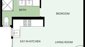A floor plan of a 32m2 apartment with a living room, bedroom, bathroom, and an eat-in kitchen. - Botanica Studio Edge Hill (Cairns)