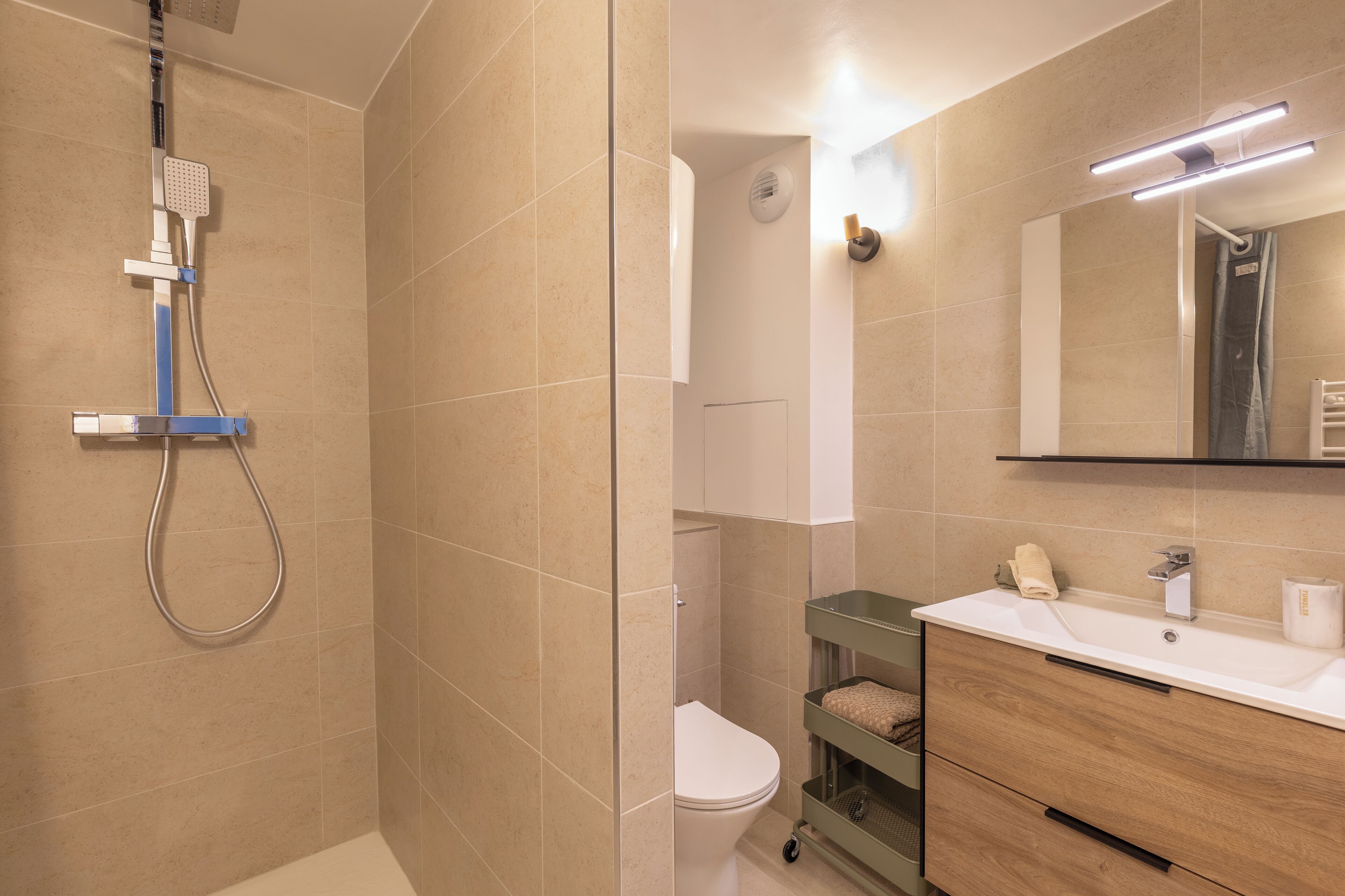 Shower, hair dryer, towels, toilet paper