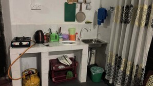 A compact kitchen with a gas stove, sink, and various utensils. - Pap de home (Weligama, Weligama, Hettiweediya)