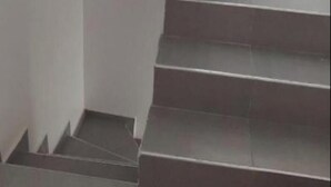 A staircase with dark grey steps and white walls. - Exclusive One-bedroom house with kitchen,and terrace in Kasbah of Tanger (Tanger)