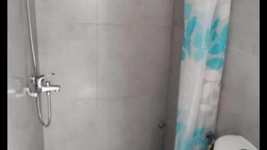 A shower with a metal handle and a curtain with a blue leaf pattern. - Exclusive One-bedroom house with kitchen,and terrace in Kasbah of Tanger (Tanger)