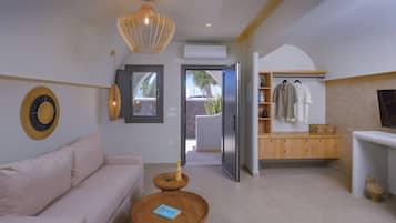 Junior Suite | Living room | 32-inch flat-screen TV with satellite channels