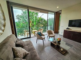 Comfort Apartment, Pool View | Living area | Flat-screen TV