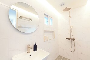 Shower, hair dryer, towels, soap