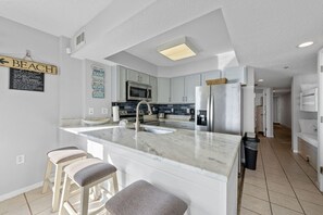 Fridge, microwave, oven, stovetop - Four Winds 704 | 2BR | Gulf Front (Orange Beach)