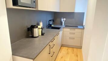 Comfort Apartment | Private kitchen | Fridge, microwave, stovetop, dishwasher