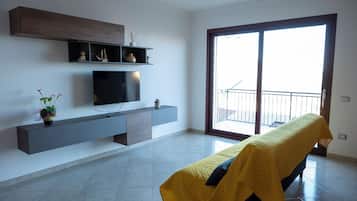 Condo, Balcony | Living area | Flat-screen TV