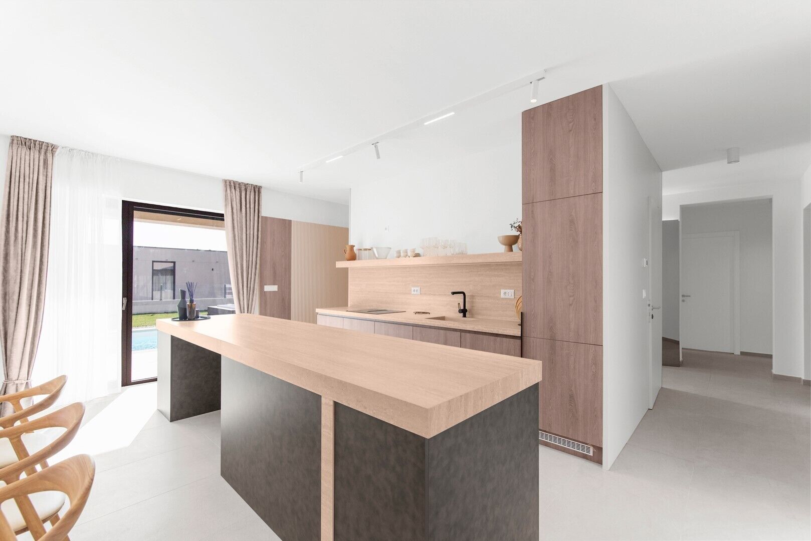 A modern kitchen with a central island, wooden cabinets, and a large window.