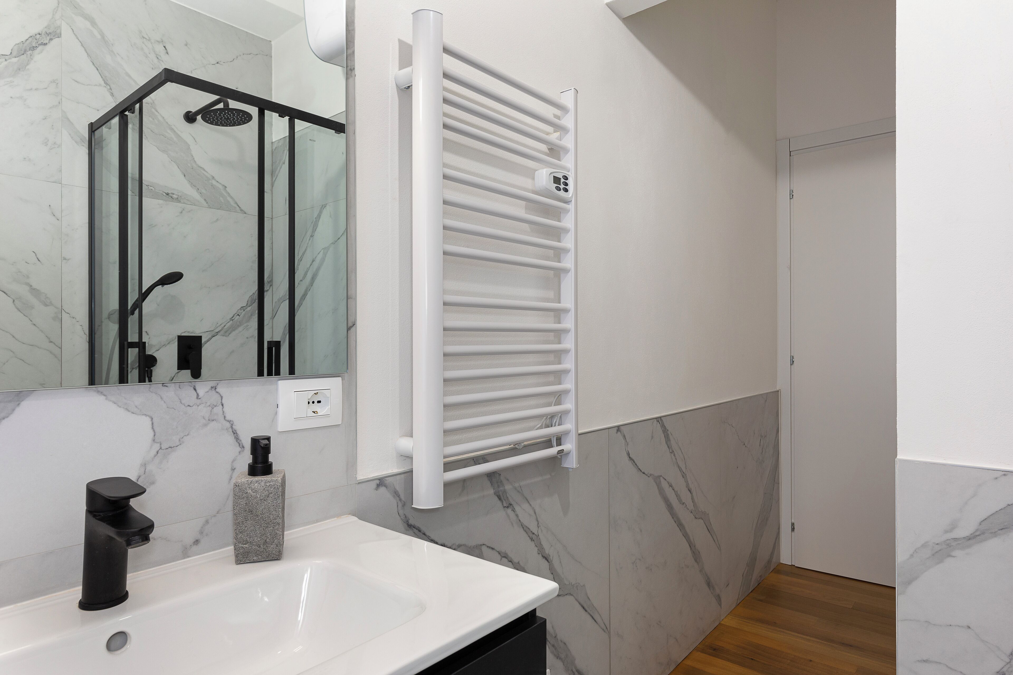 Shower, hair dryer, towels, toilet paper