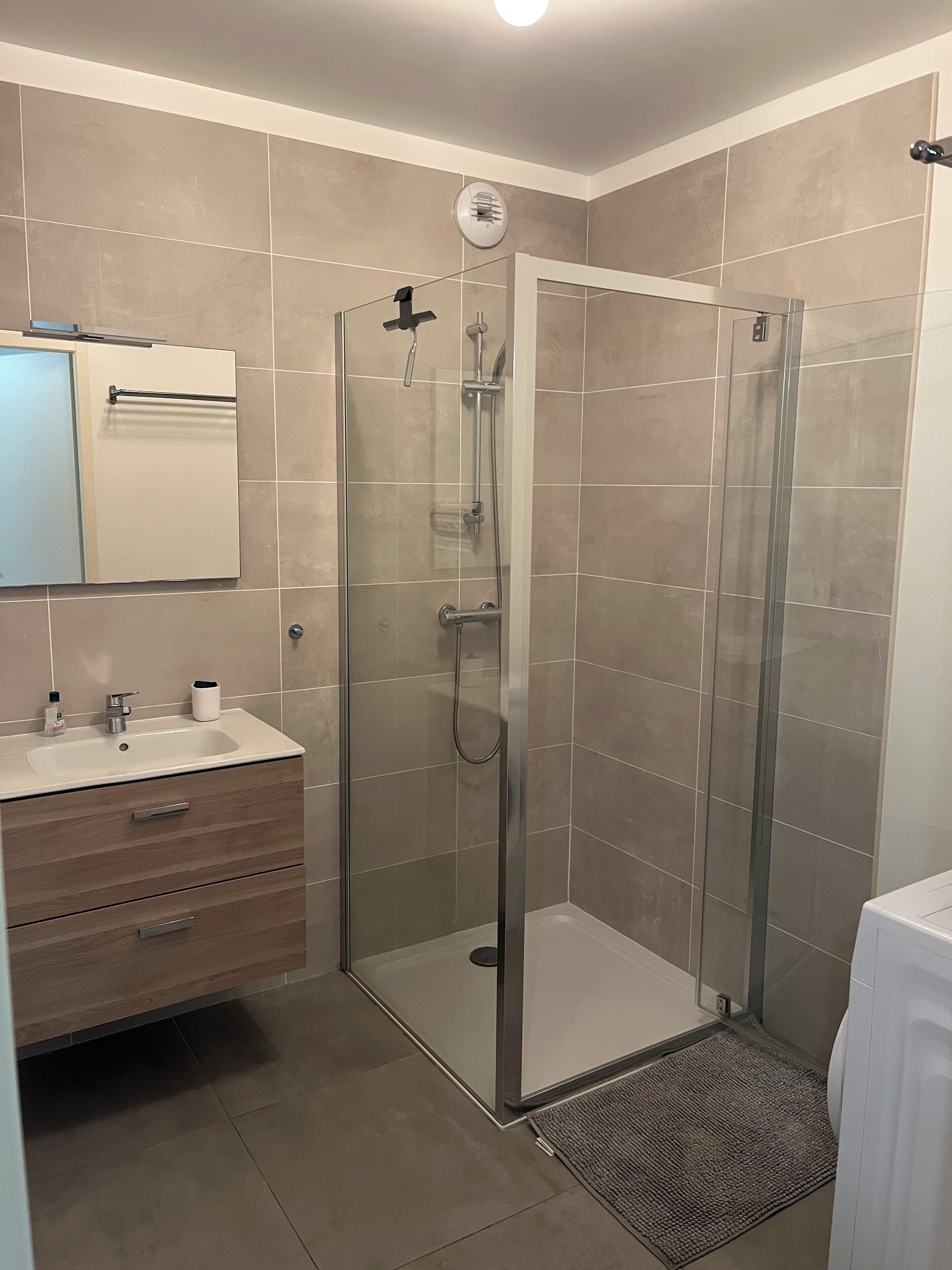 Shower, hair dryer, towels, toilet paper