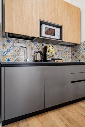 Luxury Suite, 1 Double Bed with Sofa bed, Private Bathroom, City View | Private kitchen | High chair - Spàzio apartments Crociferi Suite (Catania)