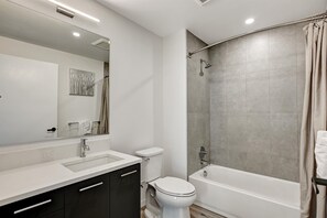 Combined shower/tub, hair dryer, towels, soap