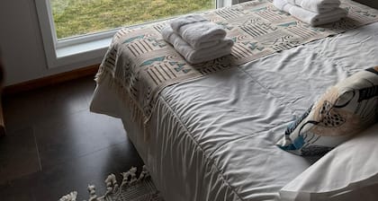 Cozy cabin with stunning sea and mountain views.