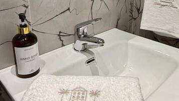 Double Room, Courtyard View | Bathroom | Shower, hair dryer, slippers, towels
