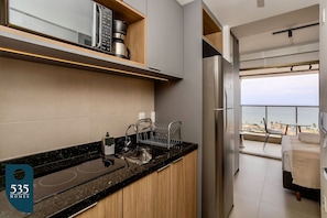Coffee/tea maker, fridge, microwave, cookware/dishes/utensils - Ocean View Studio on the Rio Vermelho Waterfront (Salvador)