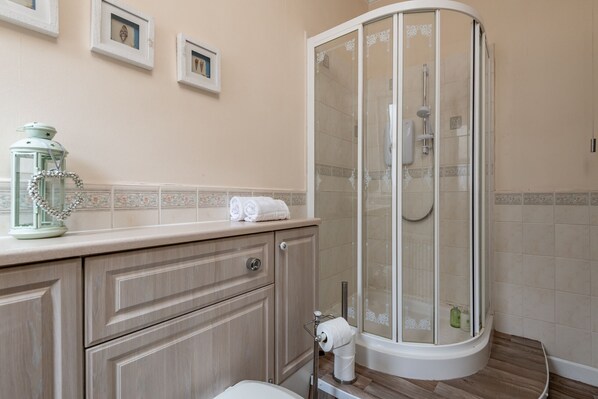 Shower, hair dryer, towels, soap