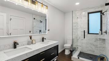 Shower, hair dryer, towels, soap